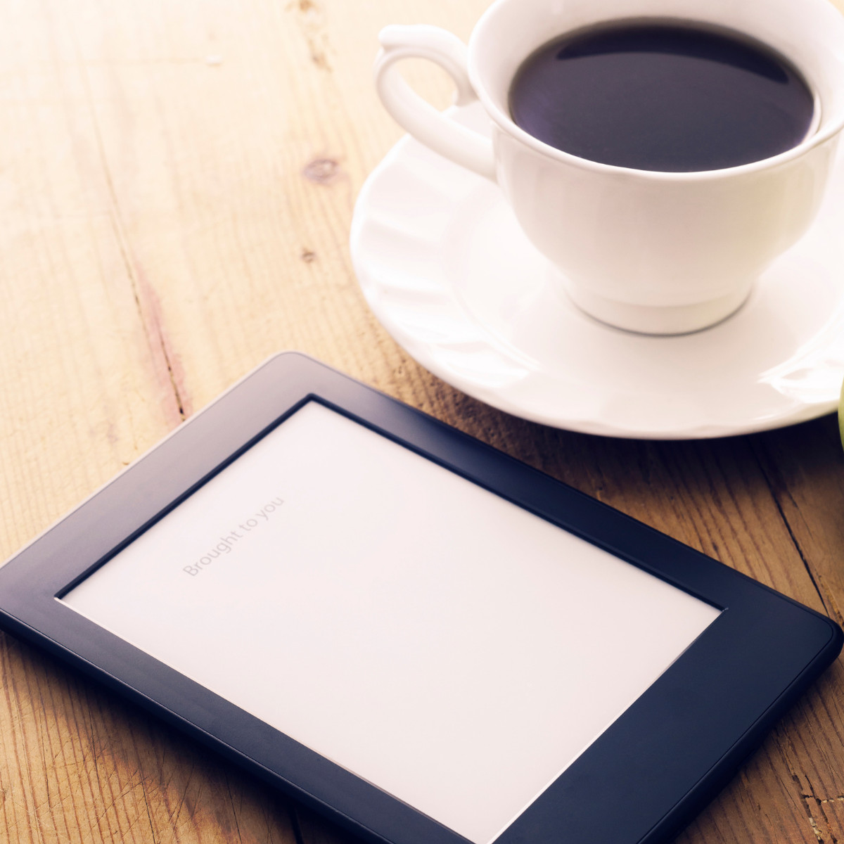 kindle and coffee cup.