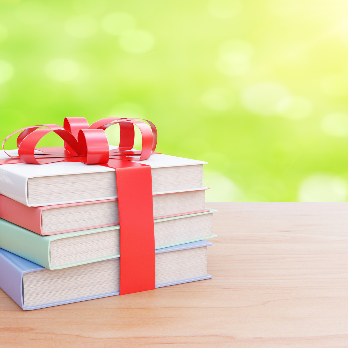 stack of books wrapped in a bow.