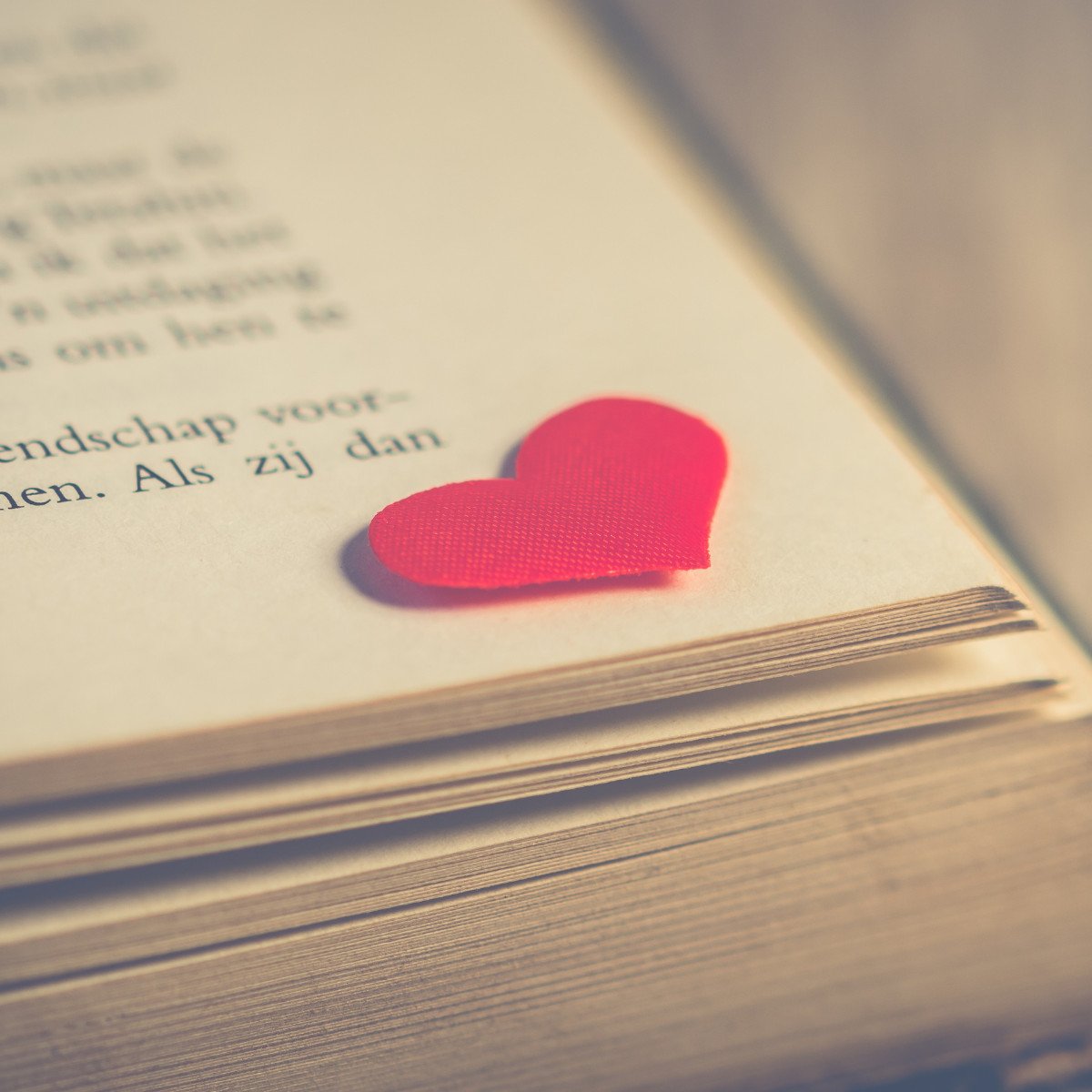 heart on an open book.