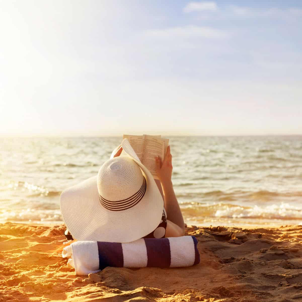 woman reading on beach.