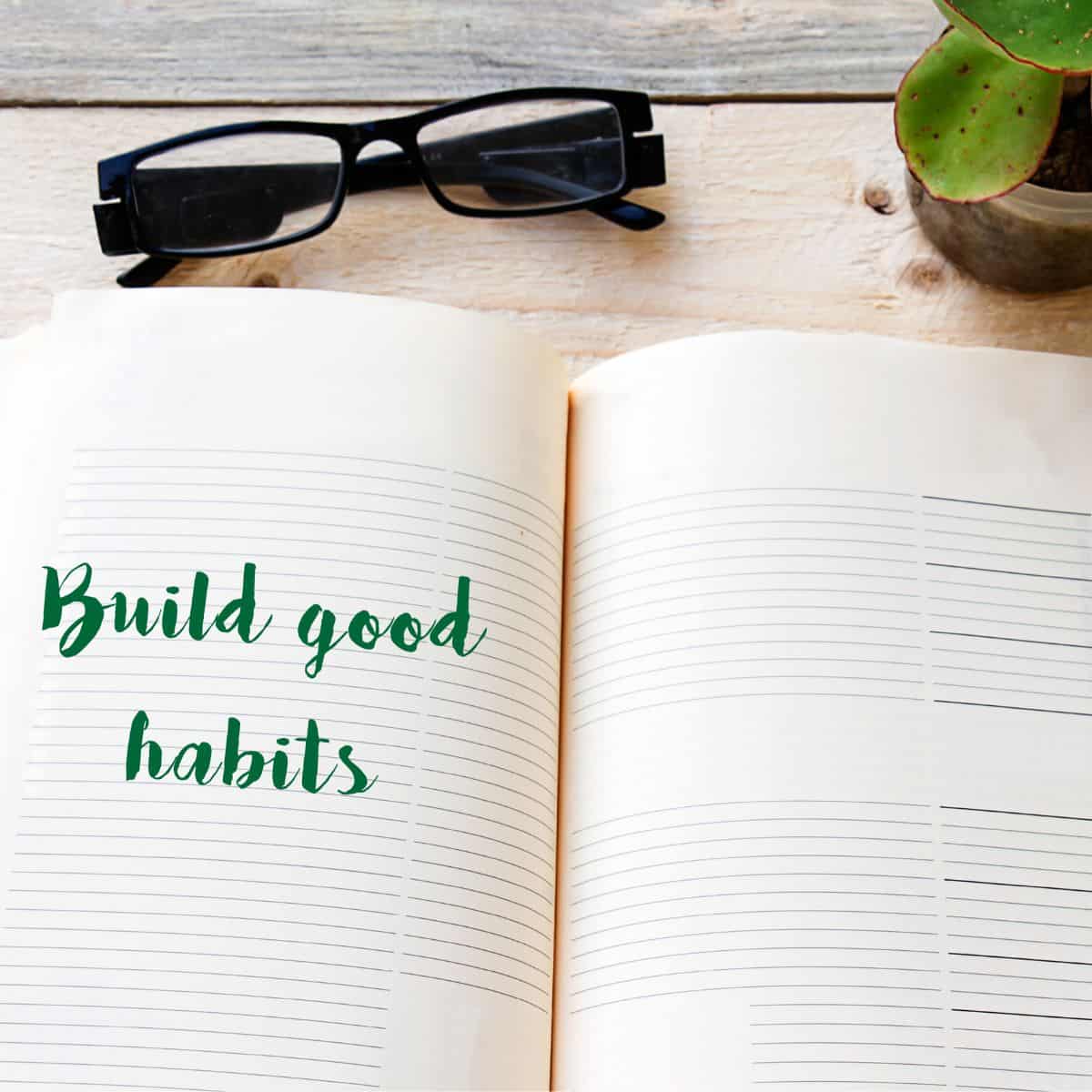 "build good habits" written on a book.