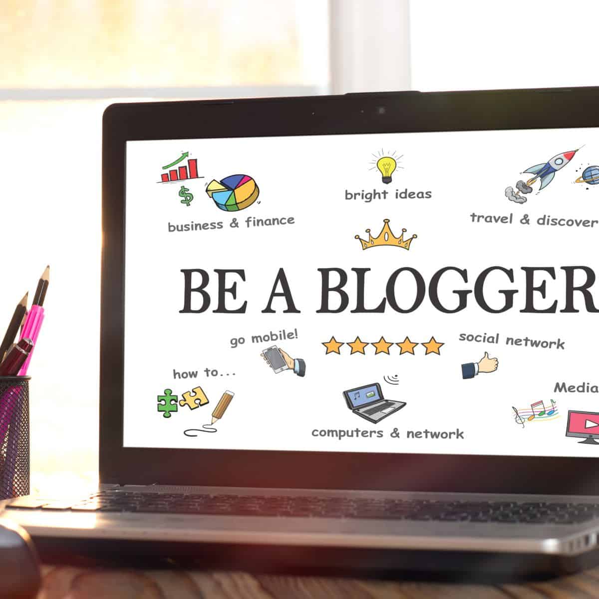 "be a blogger" written on laptop screen.