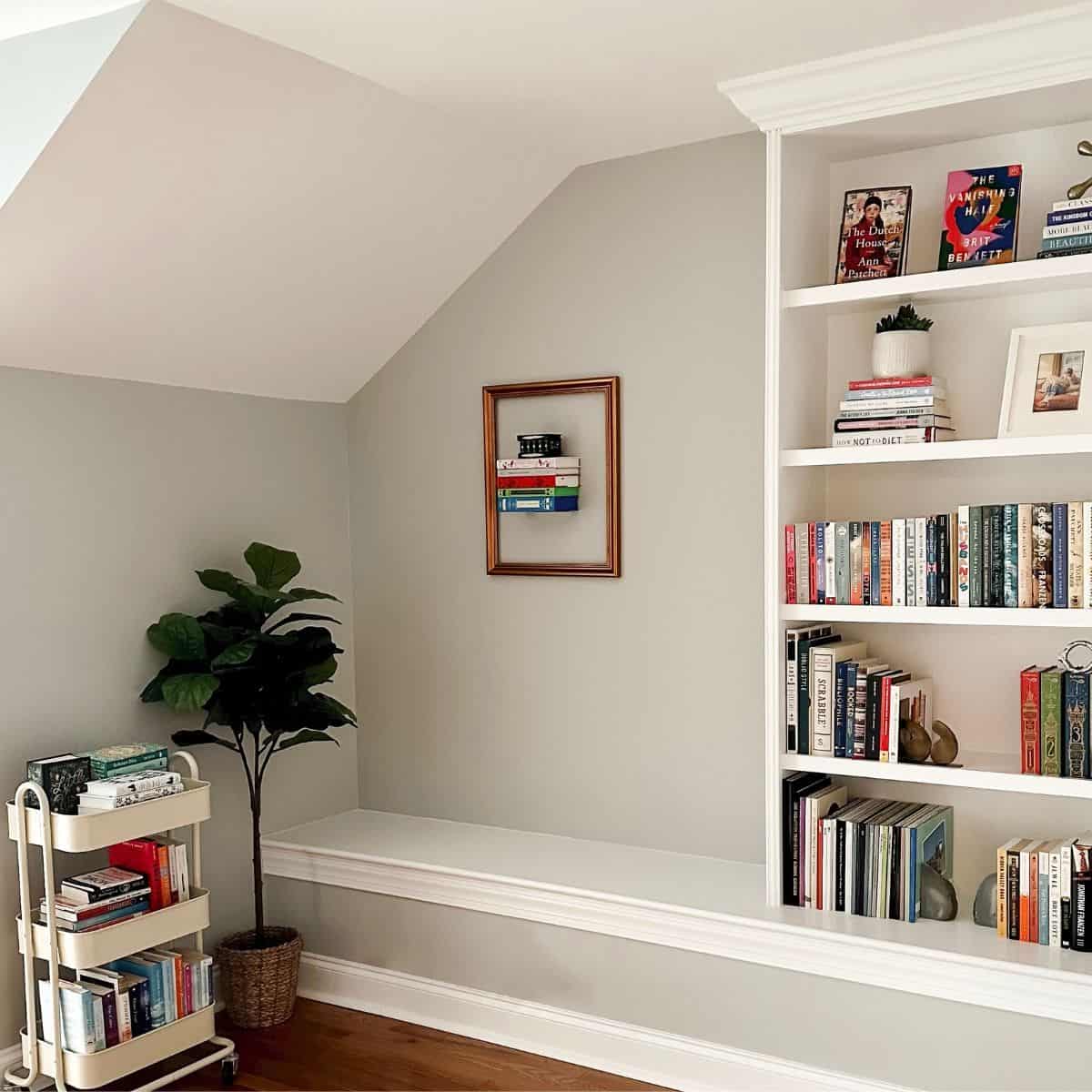 reading room view of books on invisible floating bookshelf with a frame around them.