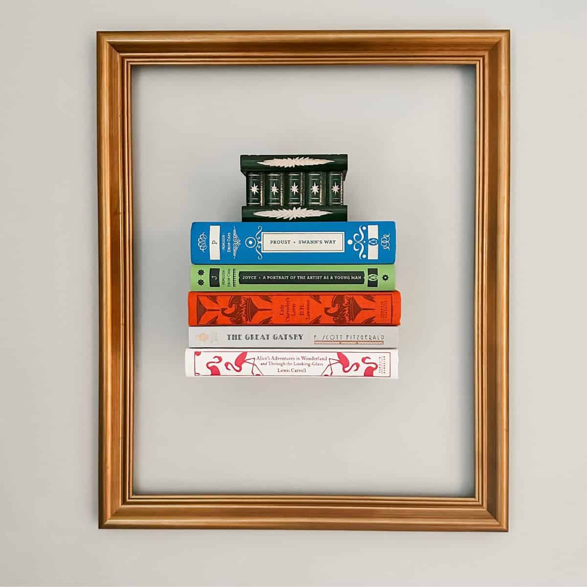 books on invisible floating bookshelf with a frame around them.