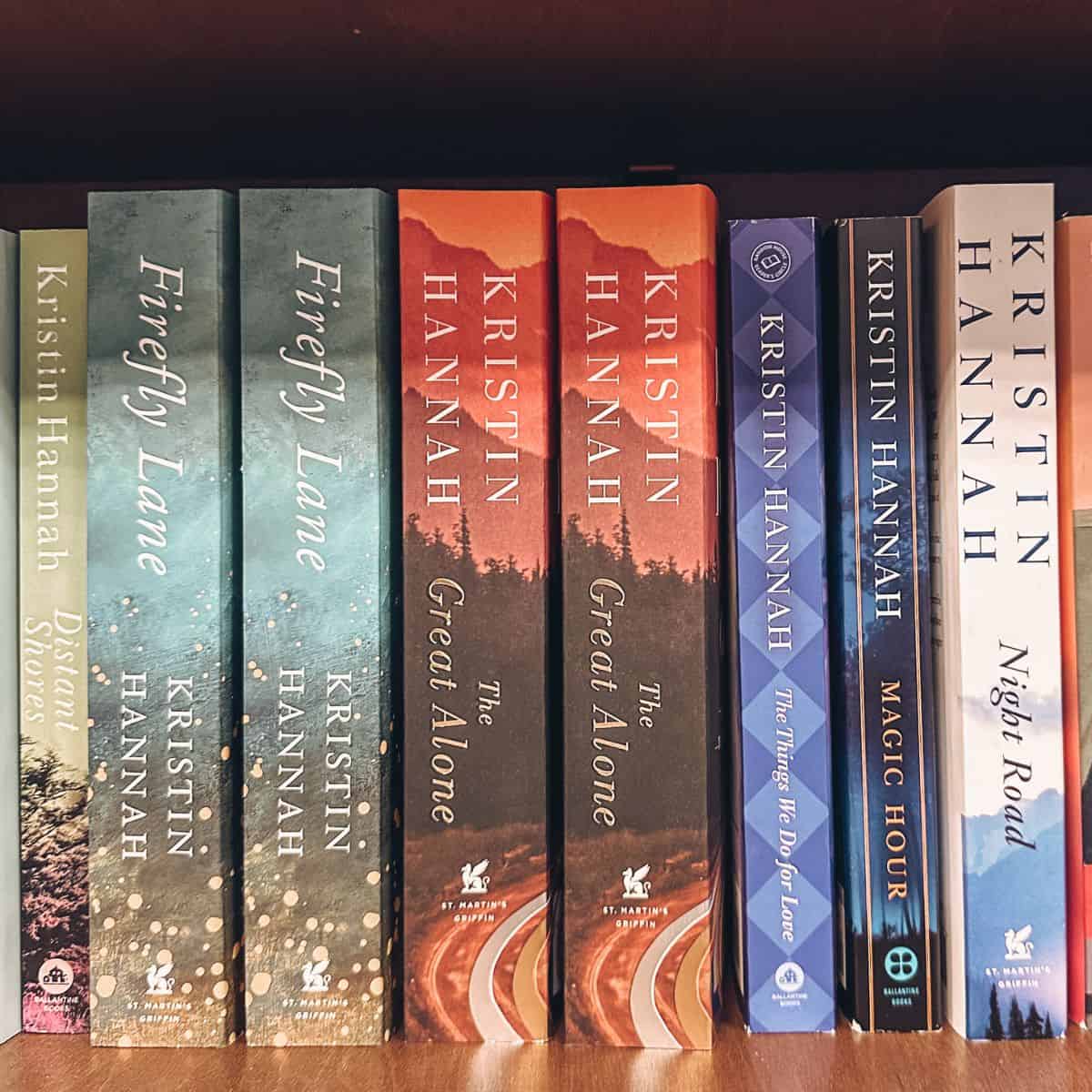 books by kristin hannah on a bookshelf.