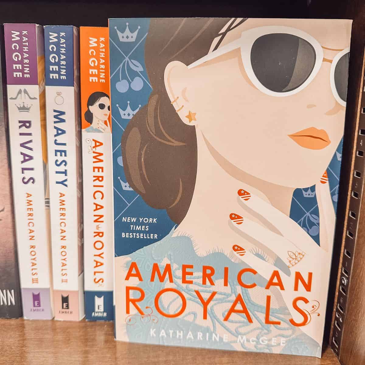 American Royals by Katharine McGee on a bookshelf with other books in the series.