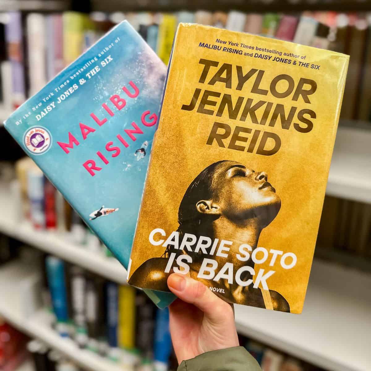 taylor jenkins reid books malibu rising and carrie soto is back in front of bookshelves.