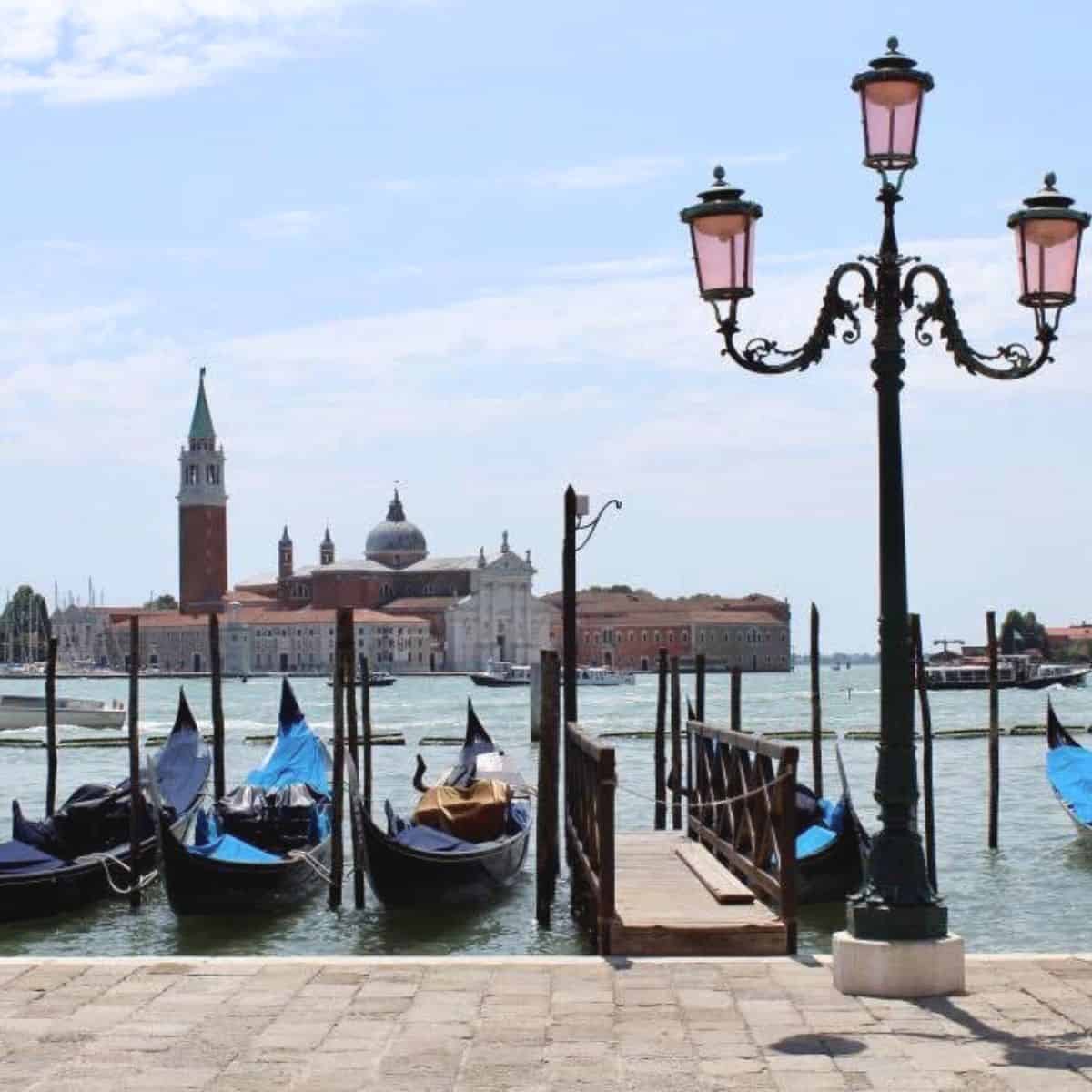 view of gondolas and canals in venice italy.