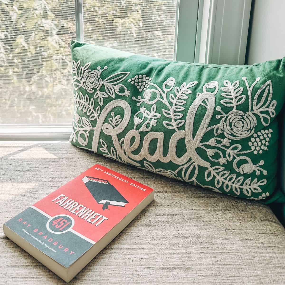 fahrenheit 451 by ray bradbury with a pillow that says "read."