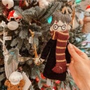 harry potter christmas ornament in front of a tree.