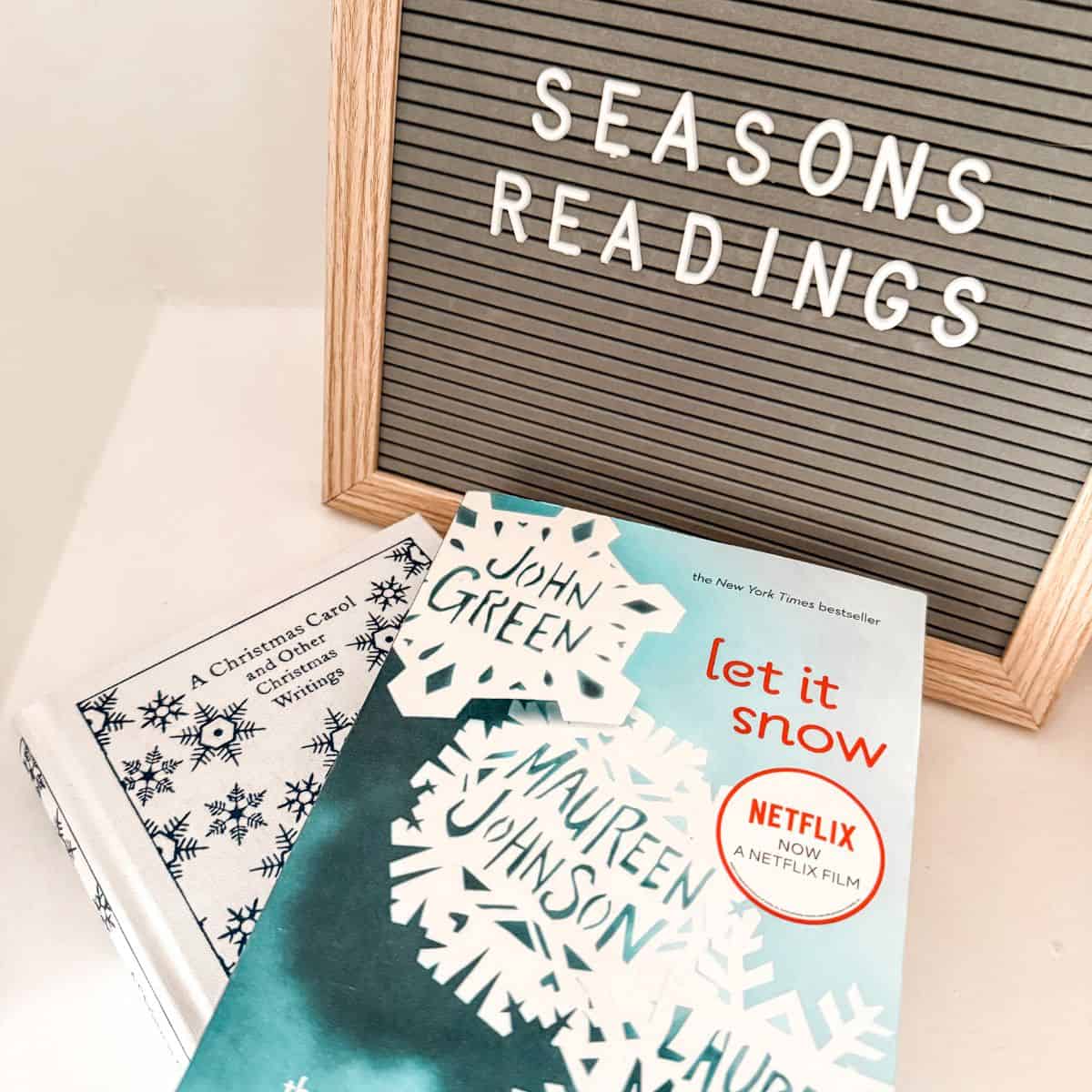 stack of young adult christmas books with sign that says christmas readings.